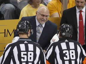 Then-Washington Capitals head coach Barry Trotz works his charm on the officials during a 2017-18 NHL game, the season the Caps won the Stanley Cup.