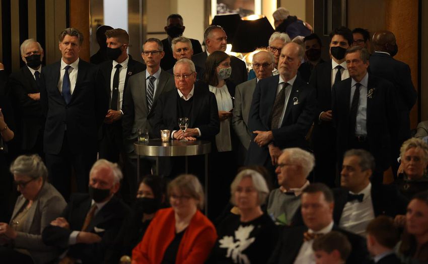 Former Toronto Mayor David Crombie, centre, listens to speeches alongside Prime Minister Justin Trudeau and Toronto Mayor John Tory at the Carlu on Wednesday.