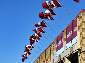 Canadian flag flapping in the wind outside a storage complex