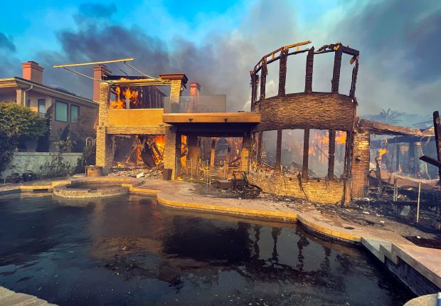 A burnt home on Coronado Pointe during the Coastal Fire...