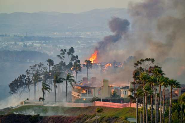 Homes burns on Coronado Pointe during the Coastal Fire in...
