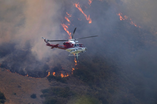 Firefighters battle a brush fire in Laguna Niguel. (Photo by...