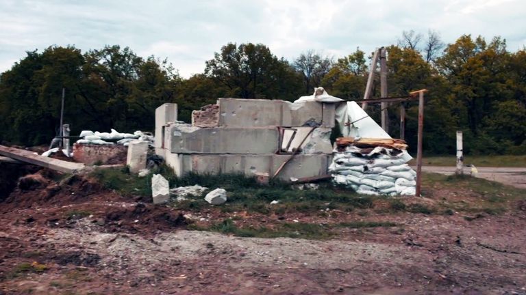 Damaged buildings and destroyed Russian vehicles litter the ground in Staryi Saltiv