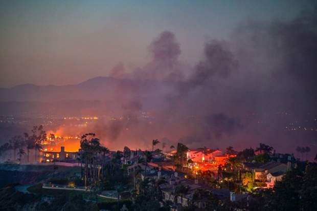 Homes burns during the Coastal Fire in Laguna Niguel, CA,...