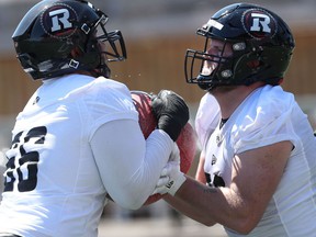 Redblacks rookie camp begins Wednesday at TD Place in Ottawa.  Zack Pelehos (right).