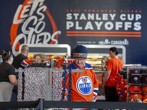 Edmonton Oilers fans check out Oilers merchandise at Rogers Place as they wait for the start of Game 6 between the Oilers and Los Angeles Kings.  Taken on Thursday, May 12, 2022 in Edmonton.  Greg Southam/Post Media