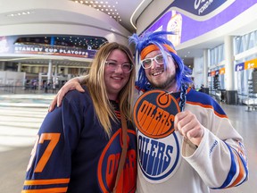Edmonton Oilers fans Ashley Howatt and James Human walk into Rogers Place to watch game 6 in the first round of the playoffs between the Oilers and Los Angeles Kings.  Taken on Thursday, May 12, 2022 in Edmonton.  Greg Southam/Post Media