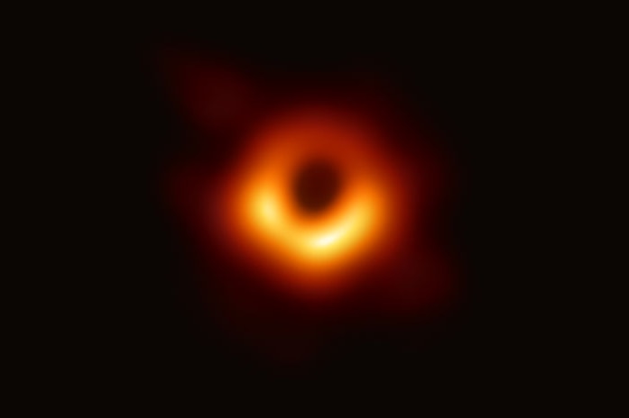 A fuzzy orange-red ring with a black spot in the center.