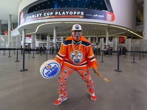 Blair Gladue, better known as Superfan Magoo on social media, tries to get Edmonton Oilers fans coming into Rogers Place pumped up as they wait for the start of Game 6 between the Oilers and Los Angeles Kings.  Taken on Thursday, May 12, 2022, in Edmonton.