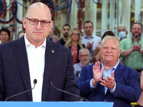 Windsor Mayor Drew Dilkens, left, and Premier Doug Ford are shown at a press conference on Friday, May 13, 2022 at the Valiant TMS facility in Windsor.