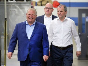 Premier Doug Ford, left, Windsor Mayor Drew Dilkens and Sladjan Milidrag, Vice President of Global Powertrain Operations at Valiant TMS are shown prior to a press conference on Friday, May 13, 2022 in Windsor.