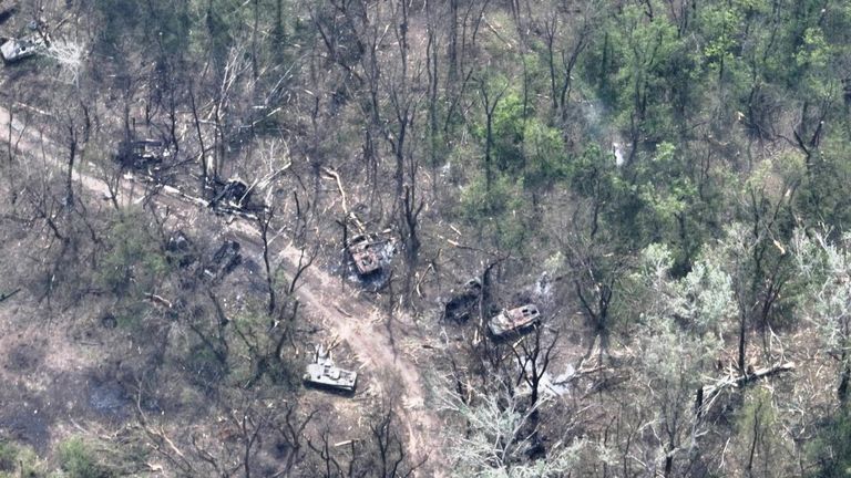 An aerial view of burned vehicles on the banks of the Siverskyi Donets River in eastern Ukraine in this handout image uploaded on May 12, 2022. Ukrainian Airborne Forces Command/Handout via REUTERS THIS PICTURE HAS BEEN SUPPLIED FOR A THIRD PARTY.