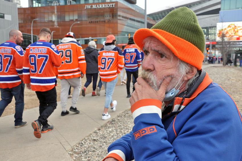 Curtis Smith panhandles outside of Rogers Place during a playoff Oilers game.