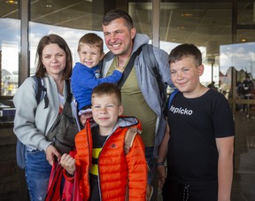Roman and Olha Koval, and their three sons, Oleh, 11, Taras, 7, and Yurii, 3, are among a group of people fleeing the war from Ukraine, arriving at a terminal at Toronto Pearson International Airport on a plane from Poland, operated by Samaritan's Purse Canada on Sunday, May 15, 2022. ERNEST DOROSZUK/TORONTO SUN