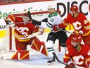 Calgary Flames goalie Jacob Markstrom stops Dallas Stars forward Michael Raffl in overtime during Game 7 of their first-round playoff series at Scotiabank Saddledome in Calgary on Sunday, May 15, 2022.