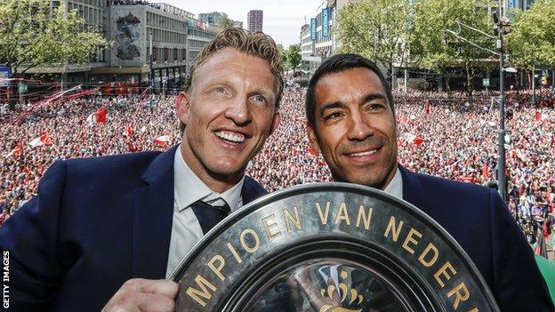Giovanni van Bronckhorst, right, celebrates Feyenoord's title win with Dirk Kuyt