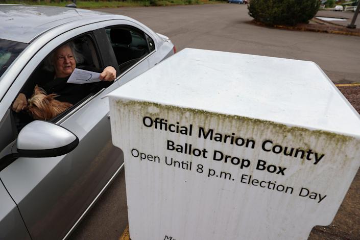 Voters drop off ballots ahead of the election at Marion County Health and Human Services in Salem, Ore. on Saturday, May 14, 2022.