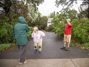 The Stittsville area and many other parts of the Ottawa region were hit by a powerful storm on Saturday, May 21, 2022.  Firefighters run up Carleton Cathcart Street.