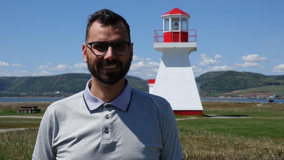 The mayor of Carleton-sur-Mer, Mathieu Lapointe, photographed in front of the Pointe Tracadigash lighthouse, near the campsite.