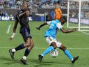 CF Montréal's Kamal Miller defends against Charlotte FC's Harrison Afful during the second half at Bank of America Stadium in Charlotte, NC, on May 14, 2022.