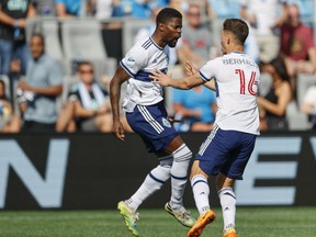 Vancouver Whitecaps striker Tosaint Ricketts, left, celebrates with teammate Sebastian Berhalter after scoring against Charlotte FC in the second minute of the first half of an MLS soccer match in Charlotte, NC, Sunday, May 22, 2022.