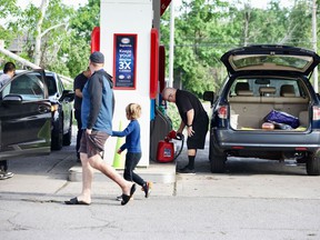 The Esso station at Hunt Club and Conroy roads was open on Sunday morning, May 22, 2022. There were lineups with people filling containers with gas.
