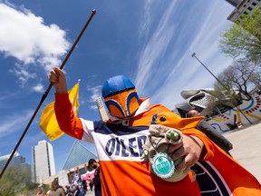 Mandalorian Tyler Mike and Grogu dressed up for an Edmonton Oilers fan rally held at Sir Winston Churchill Square to cheer the Oilers' playoff trip in Edmonton on Tuesday, May 24, 2022. The Oilers face the Calgary Flames in Game 4 of the Battle of Alberta series at Rogers Place tonight.