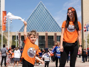 Teresa Marshall and her son Emery, 5, won Game 4 tickets during an Edmonton Oilers fan rally held at Sir Winston Churchill Square to cheer the Oilers' playoff trip in Edmonton on Tuesday, May 24, 2022. The Oilers face the Calgary Flames in Game 4 of the Battle of Alberta series at Rogers Place tonight.  It will be Emery's first Oilers game.  Photo by Ian Kucerak