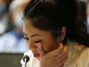 Christina Trang speaks about her father Hung Trang, who was killed in Chinatown, as Chinatown's community filled city council chambers for a discussion about the Community Safety and Well-being Strategy in Edmonton, on Tuesday, May 24, 2022. Photo by Ian Kucerak