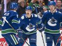 Alex Chiasson #39 of the Vancouver Canucks celebrates with teammates JT Miller #9 and Vasily Podkolzin #92 after scoring a goal against the Phoenix Coyotes during the first period at Rogers Arena on April 14, 2022 in Vancouver.