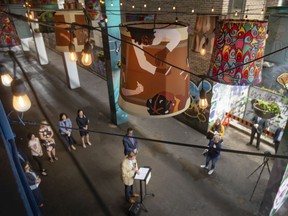 Art in the air: Phase one of Art Alley, located north of Maiden Lane, between Pelissier Street and Ouellette Avenue, is unveiled during a press event highlighting the $794,000 in funding provided to projects as part of the Canada Healthy Communities Initiative, on Thursday, May 27, 2022.
