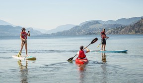 Stand up paddle boarding on Okanagan Lake in Penticton.  BC TOURISM PENTICTON