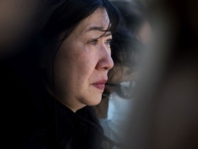 Tear runs down the cheek of Dr. Holly Mah, Chair of Chinatown and Area Business Association, as she attends a Chinatown safety rally outside City Hall, in Edmonton Saturday, May 28, 2022. David Bloom-Postmedia