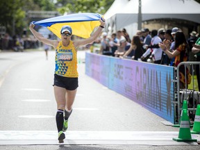 Yuliya Tarasova finished the marathon with a Ukrainian flag at Tamarack Ottawa Race Weekend, Sunday, May 29, 2022.