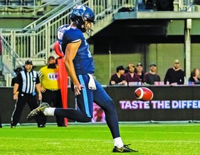 John Haggerty steps into one of his nine punts during Friday's pre-season game in Ottawa.  The Australian rookie had a 53.2 average.  (ARGONAUTS.CA PHOTO)