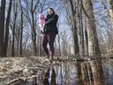 Kaitlin Kennedy and her daughter Quinn, 7 months, are shown in the South Cameron Woodlot that connects Randolph Ave. on Tuesday, March 26, 2019. The Windsor resident who has a masters degree in biology has started a petition to save the wetlands.