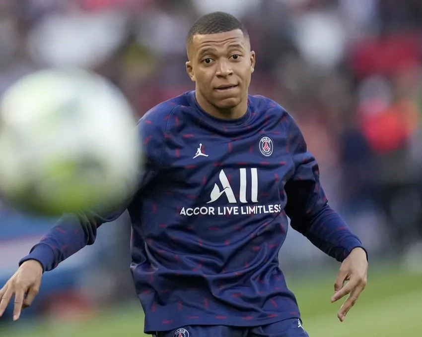 PSG's Kylian Mbappe warms up before the start of the French League One soccer match between Paris Saint Germain and Troyes at the Parc des Princes stadium in Paris, Sunday, May 8, 2022.