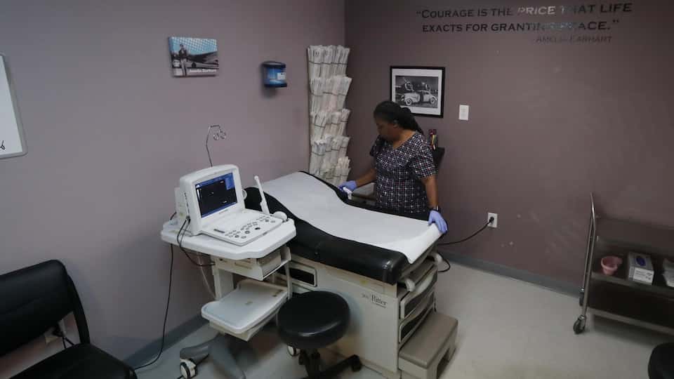 A woman prepares the operating room at Whole Woman's Health Clinic in Fort Worth, Texas.