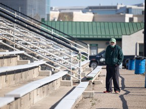 A Saskatchewan Roughriders fan shows up to watch the first day of the team's training camp in Saskatoon on Sunday, May 15, 2022, only to find out it is canceled because of a player strike.