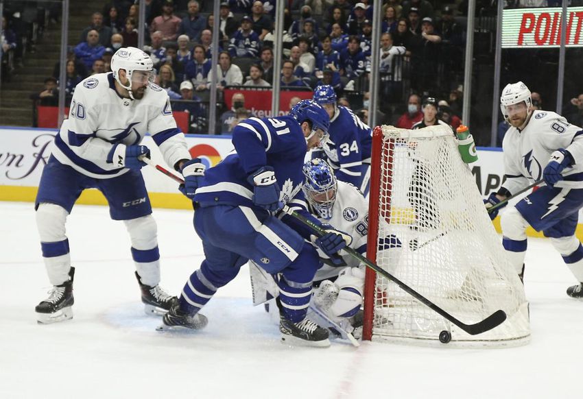 Leaf John Tavares scrambles for a loose puck on the edge of Andrei Vasilevskiy's crease late in Wednesday's loss to the Tampa Bay Lightning at Scotiabank Arena.