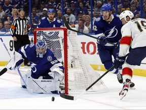 Tampa Bay Lightning goaltender Andrei Vasilevskiy defends the puck from Florida Panthers center Joe Thornton during the second period at Amalie Arena in Tampa, Fla., May 23, 2022.