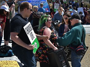 Protesters on both sides of the abortion debate clash during a March for Life rally that drew an estimated 200 to the Alberta legislature grounds in Edmonton, Thursday, May 12, 2022.