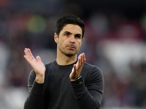 Arsenal's Spanish manager Mikel Arteta applauds at the end of the English Premier League football match between West Ham United and Arsenal at the London Stadium, in London on May 1, 2022.
