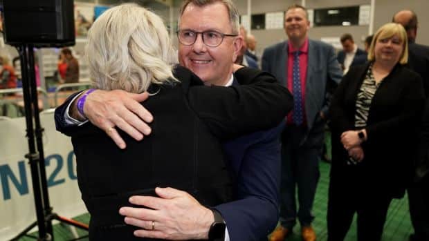 DUP leader Jeffrey Donaldson congratulates his party colleague Pam Cameron on her election at the University of Ulster counting centre.  Photograph: Brian Lawless/PA