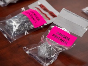 Evidence bags containing fentanyl are displayed during a news conference at Surrey RCMP Headquarters, in Surrey, BC, on Thursday, Sept.  3, 2020. The federal government is set to make what it's calling an "important announcement" with the British Columbia government on the overdose crisis.