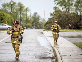 The Stittsville area, as well as many other parts of Ottawa and the surrounding area, were hit with a damaging storm on Saturday, May 12, 2022. Firefighters run up Carleton Cathcart Street.