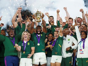 South Africa's flanker Siya Kolisi lifts the Webb Ellis Cup as they celebrate winning the Japan 2019 Rugby World Cup final match between England and South Africa at the International Stadium Yokohama in Yokohama on Nov. 2, 2019.