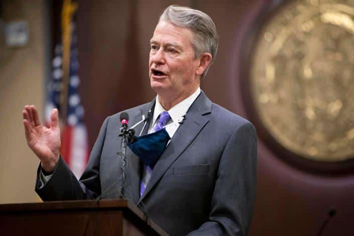 Idaho Gov. Brad Little gestures during a press conference at the Statehouse in Boise, Idaho, on Oct. 1, 2020.