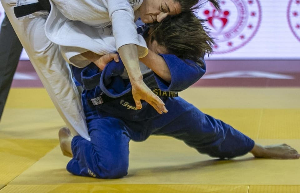 Two judokas compete. 