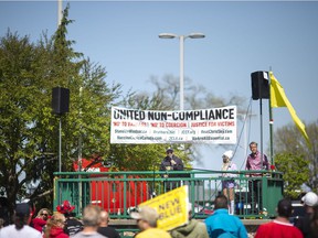 Chris Sky, a prominent figure in Canada's anti-mask and anti-lockdown movement, speaks to a small crowd of a few dozen attending a rally at Dieppe Park, on Saturday, May 7, 2022.